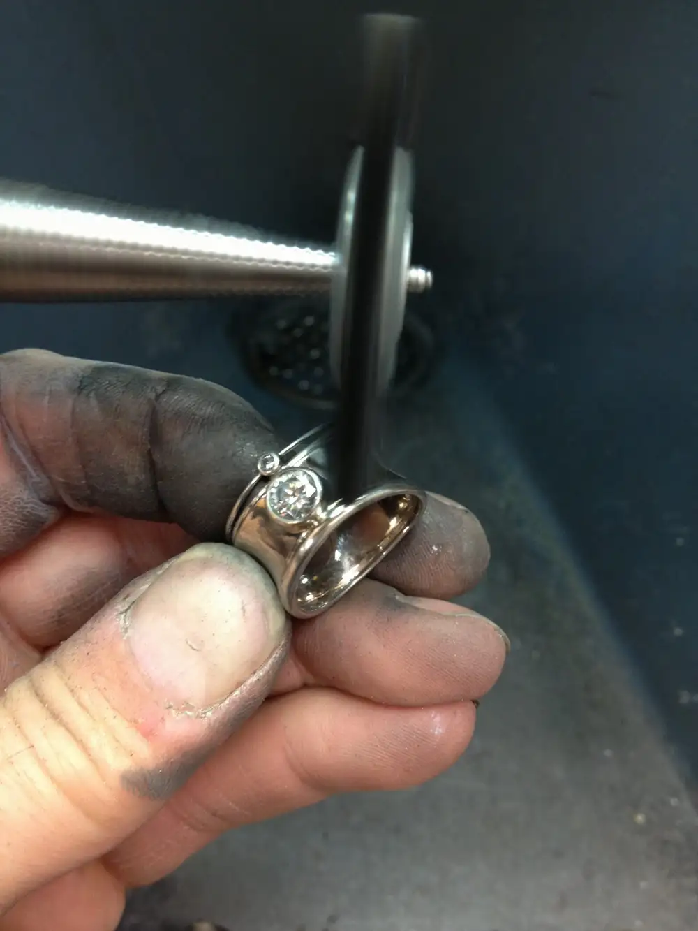 The final stage of this platinum and palladium white gold solitaire ring